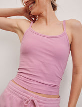 pink waist length tank with adjustable spaghetti straps.